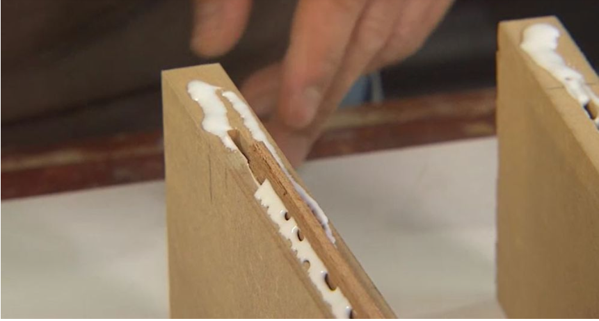 Uneven and damaged MDF board edges showing gaps that can weaken a glued joint.