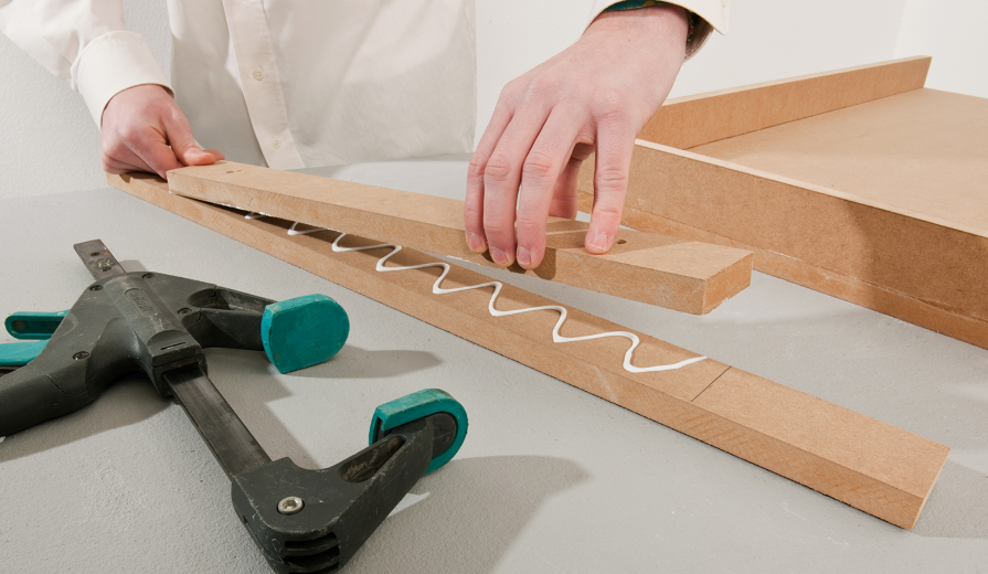Bringing two carpet edges together to create a neat, aligned seam before applying adhesive or seam tape.