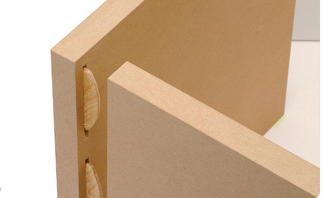 Two MDF boards joined at right angles using a simple butt joint with wood glue along the connecting edges.
