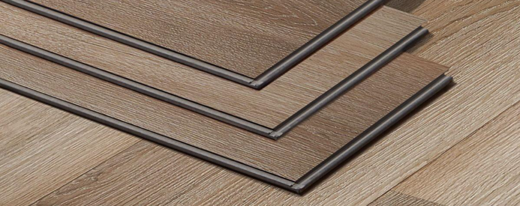 Click-lock luxury vinyl plank flooring with realistic wood-grain patterns in a modern home interior.