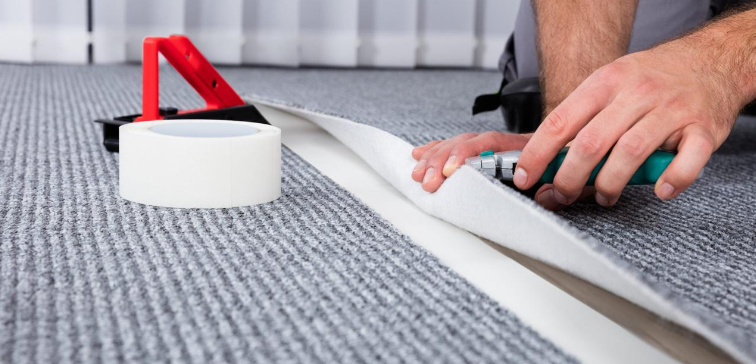 Two carpet pieces aligned edge to edge to create a straight, natural seam before heat bonding.