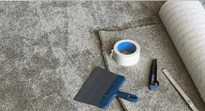 Tools and materials for carpet seaming, including a heat-bond iron, heat-activated carpet seaming tape, carpet knife, straightedge, measuring tape, and seam roller