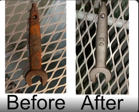 Rusty metal spanner before and after rust removal, showing a clean polished finish after restoration.