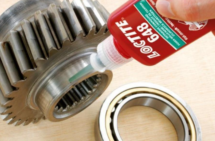 Loctite 648 high-strength retaining compound for securing cylindrical metal assemblies such as bearings and shafts.